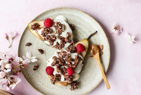 View ‘PRObiotics’ in cereals: why it’s just a gimmick A plate with a pear halved with yogurt, nut butter, granola and nut butter on top with a spoon of nut butter on the side of the plate