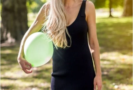 Megan Rossi holding green balloon outside