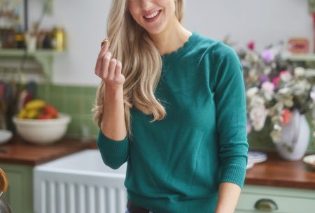 View Let’s stop demonising snacking! Megan Rossi in kitchen eating granola