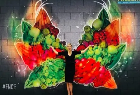 Megan Rossi with wings of vegetables in the background