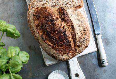 View Gluten-free diet: filling the gaps A loaf of sourdough that has been slices alongside a knife, salt, pepper, basil and a bottle of oil