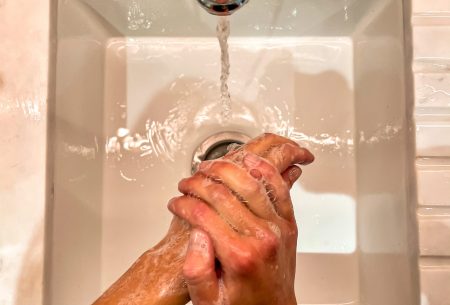 View Will sanitizer affect your gut health? A sink and tap showing washing hands with soap