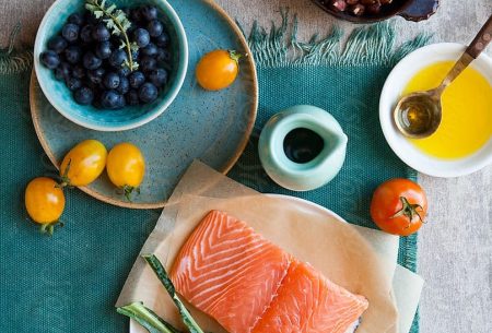 View ‘Healthy Mediterranean’ diet linked to a better quality of life A spread of the Mediterranean diet showing a fillet of salmon, cavelo nero, tomatoes, blueberries, hazelnuts and olive oil