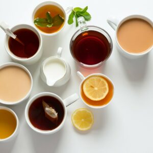Photo of a table with 9 different types of tea including black, builders and herbal teas, alongside a small jug of milk