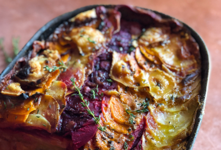 Photo of a root vegetable gratin on a kitchen worktop