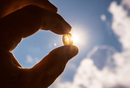 A photo of vitamin d being pointed towards the sky