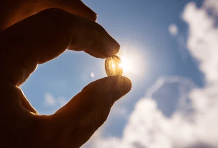 A photo of vitamin d being pointed towards the sky