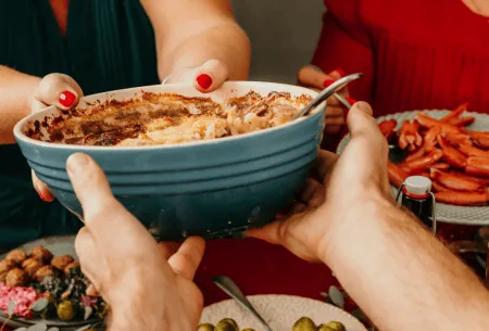 Picture of people sharing food at Christmas.