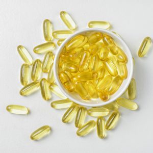 A photo of Omega 3 pills in a bowl