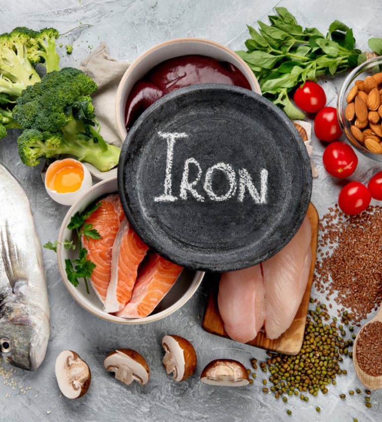 A spread of protein, vegetables and legumes and a slate plate with 