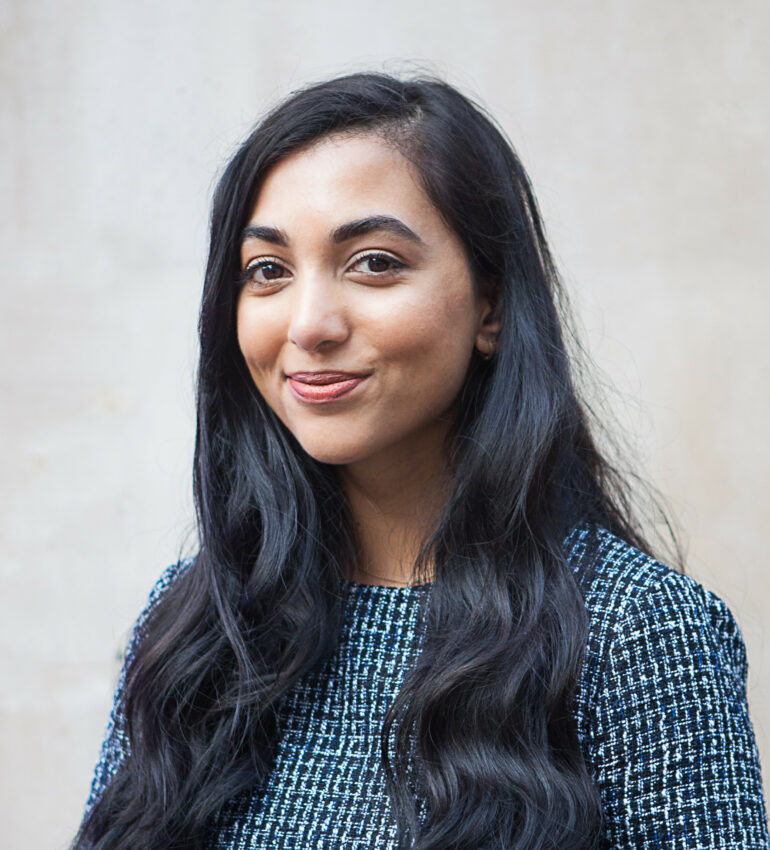 A photo of Tanzil Miah smiling at the camera