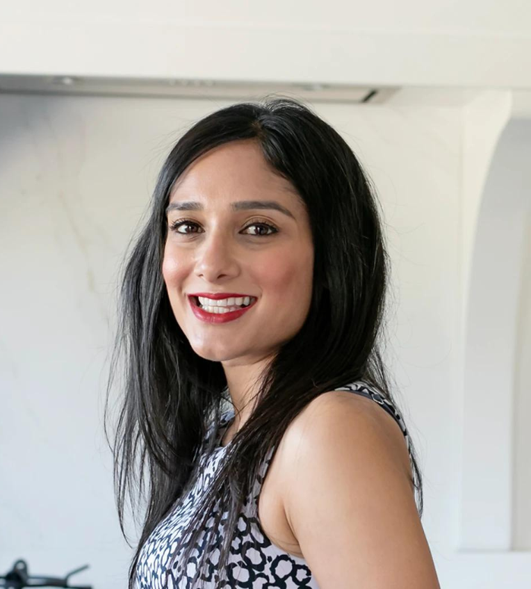Photo of Sandy Soni smiling at the camera