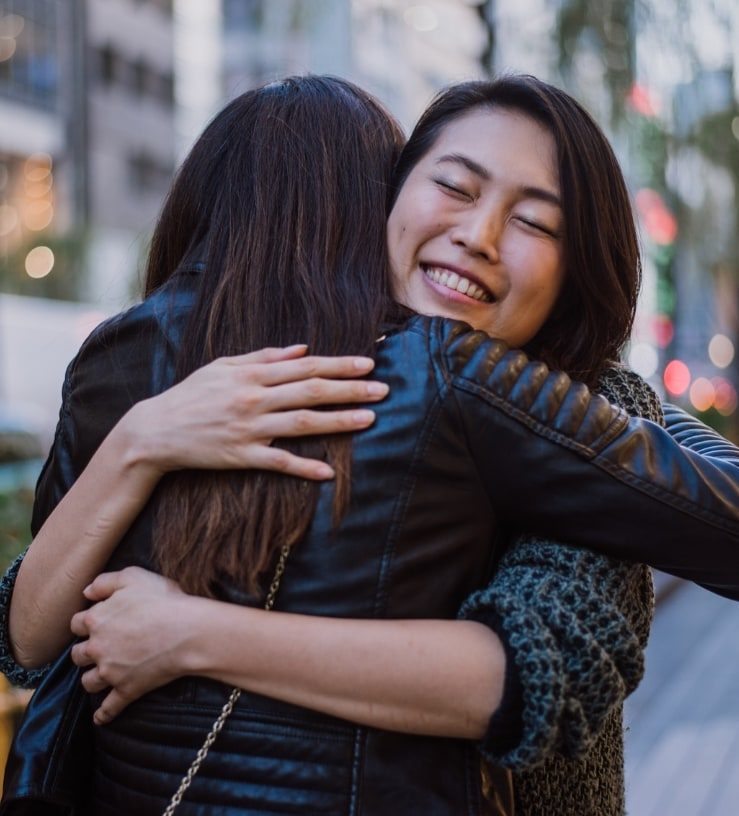 Two women hugging